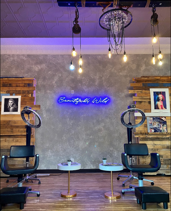 Internal view of Fix Salon with neon sign reading Beautifully Wild